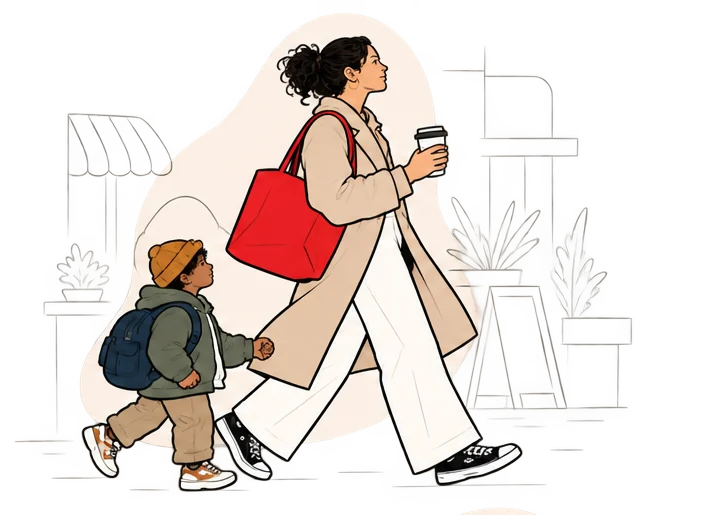 A mom with a coffee walks her son home after school.